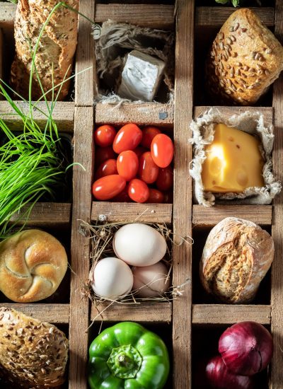 Fresh and tasty ingredients for sandwich in a wooden box